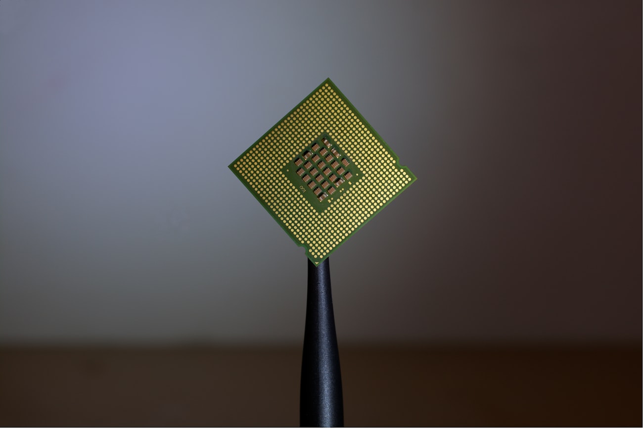 An IC handler presenting chips to a tester at temperature