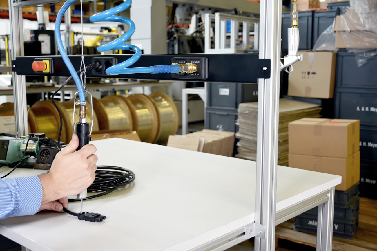 A machine vision camera inspecting trays at a chamber loading cell