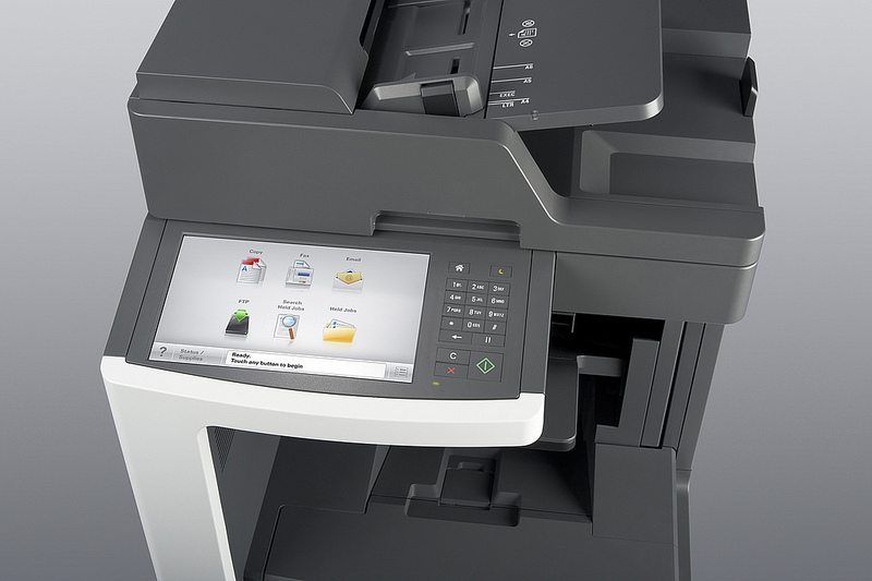 Office multifunction printer touchscreen panel showing copy, fax and email functions