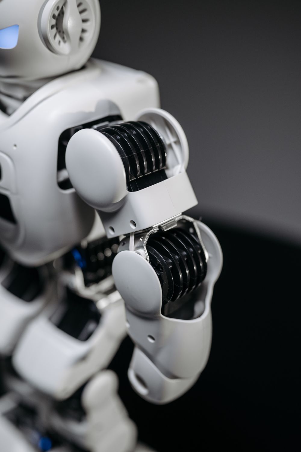 A close-up of a humanoid robot's arm joint