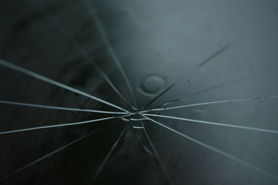 Cracks radiating across a pane of glass