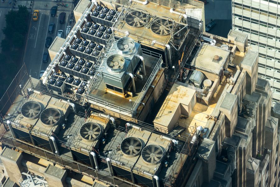 Rooftop array of refrigeration and cooling units seen from above