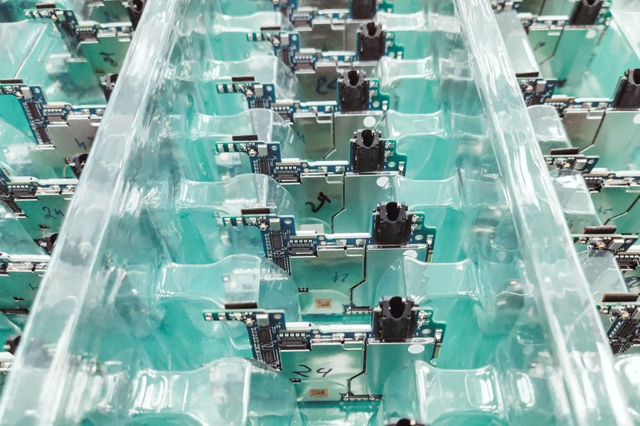 Rows of surface-mount circuit boards packed in a production tray